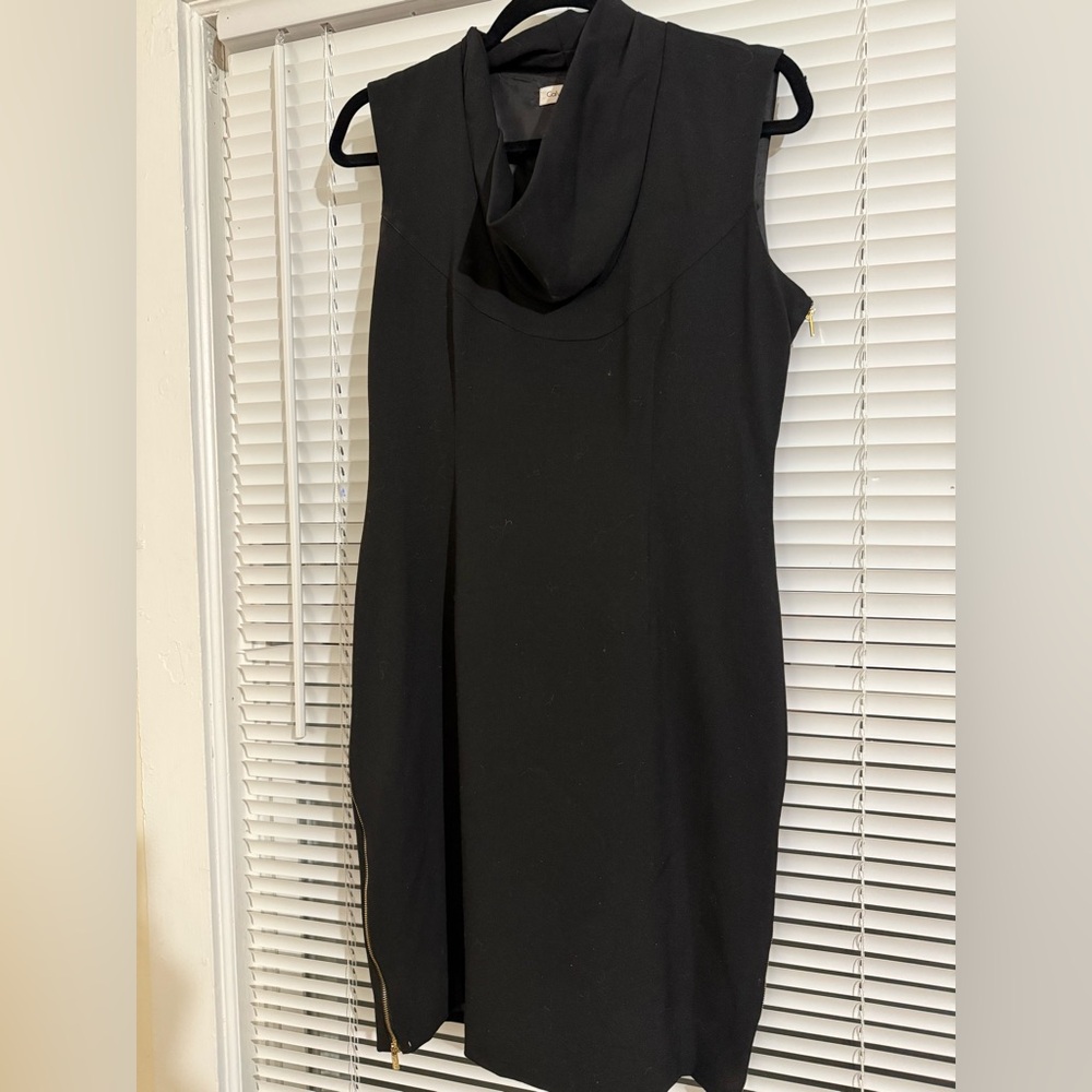 Calvin Klein little black dress with zippers on both sides of the dress
Size-10
